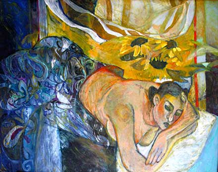 Woman in bed and sunflowers in vase